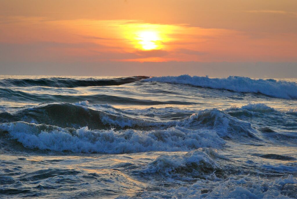 ocean water during yellow sunset